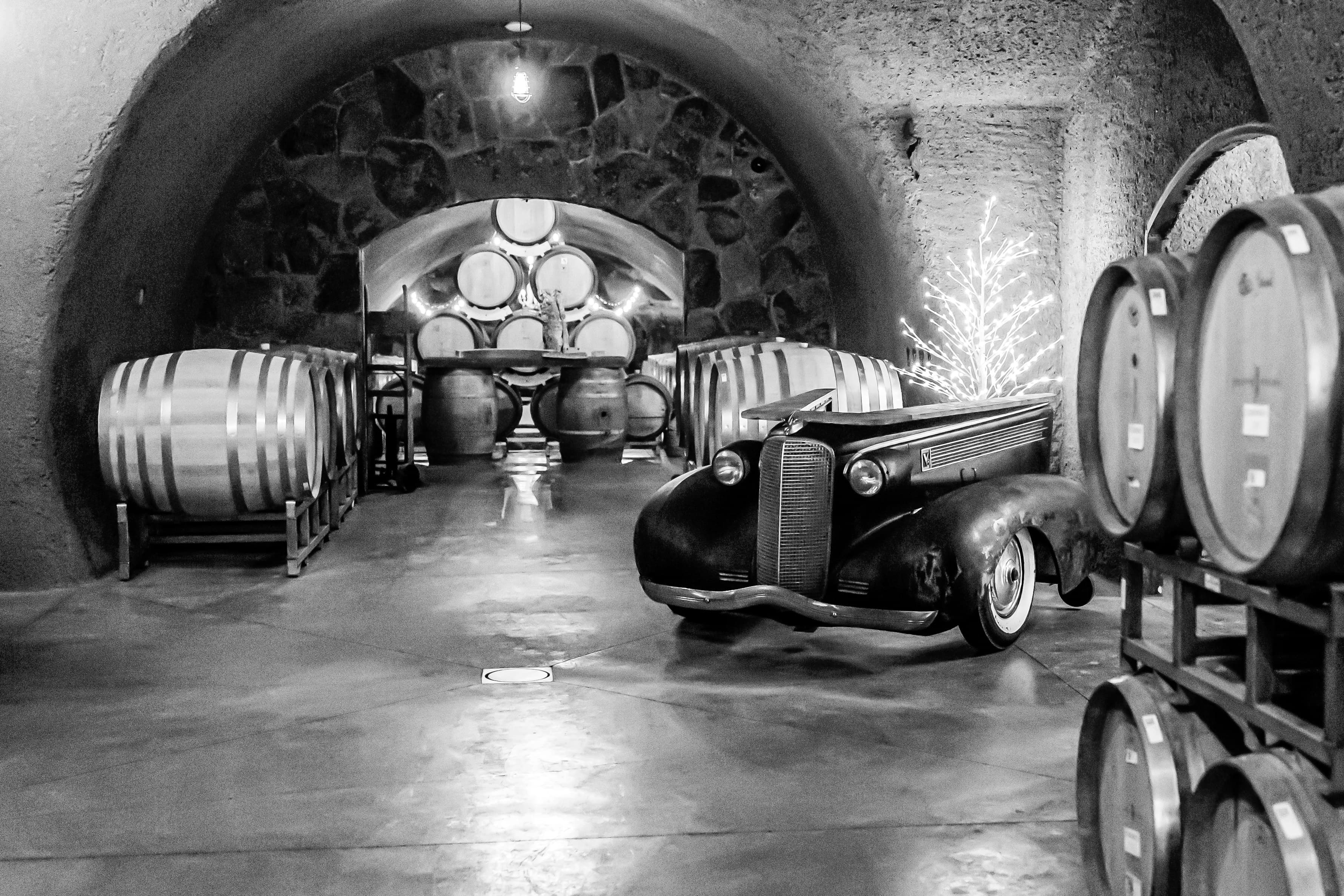 Vintage barrels aging inside the Joseph Cellars volcanic wine cave