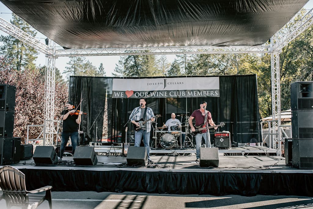 Live band performing at a Joseph Cellars wine club event
