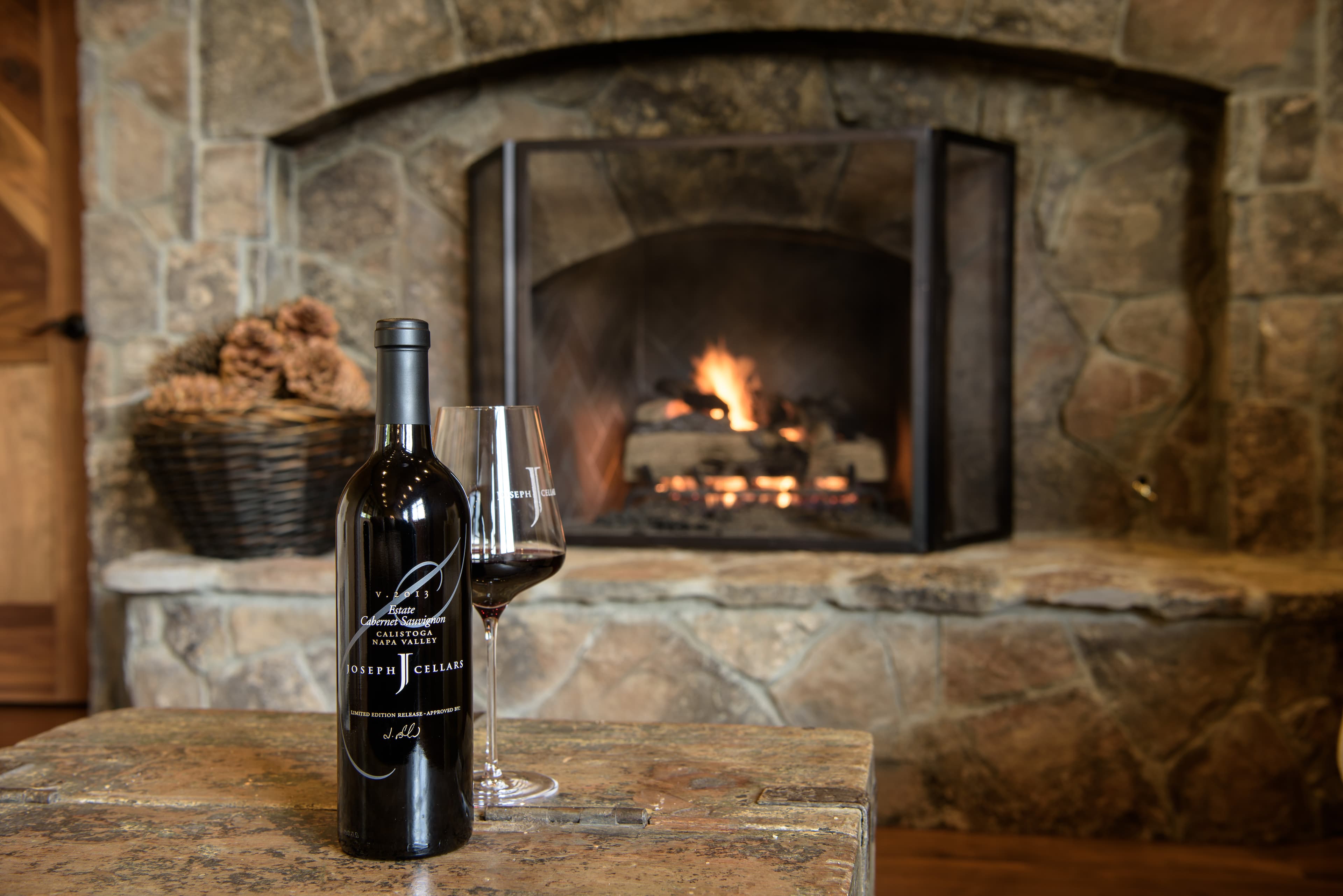 Wine by the fireplace at Joseph Cellars
