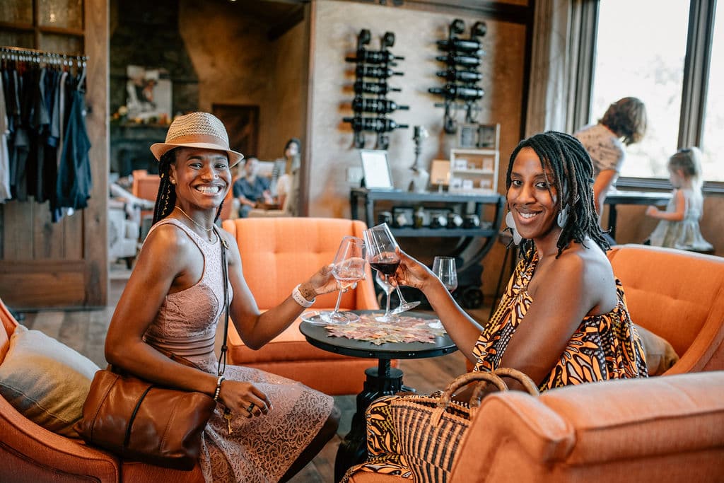 Guests toasting wine glasses in the Joseph Cellars tasting room